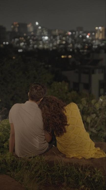 Two Spoons Full: a couple looks over city lights at night