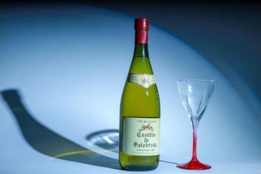 Wine bottle under a hard blue light