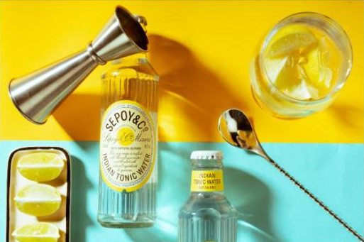 Overhead flat lay of tonic, jigger and spoon