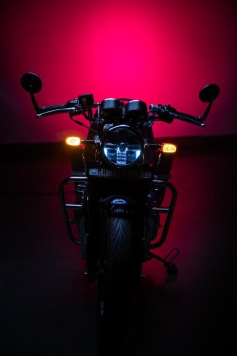 Motorcycle against a magenta backdrop